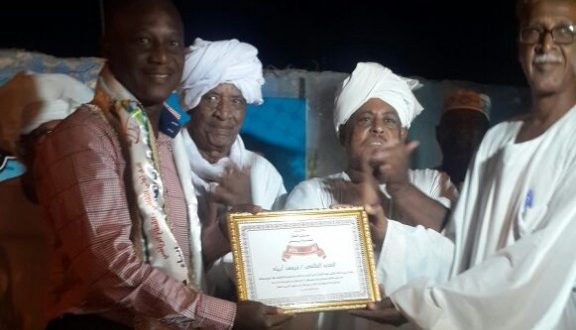 Kwesi Appiah (left) receiving his prize